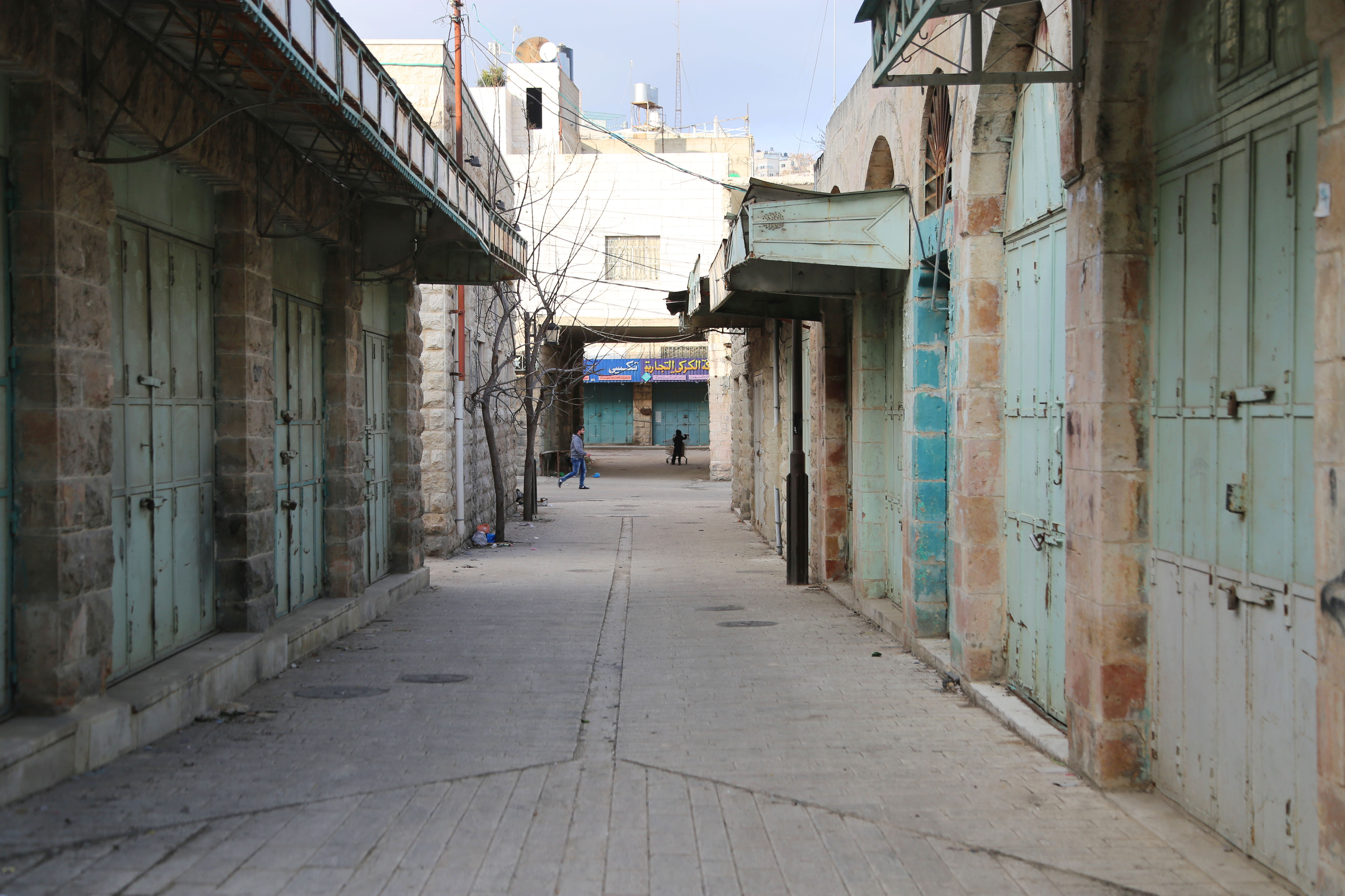 The maze-like old quarter of Hebron, a city in the West Bank home to nearly 250,000 Palestinians, used to be the region’s hub of commercial activity. Because Hebron is often regarded as the second most holy city in Judaism after Jerusalem, nearly 800 Israeli settlers have moved into the city, and violence between Israeli settlers and the city’s Palestinian inhabitants has transformed the downtown area into a ghost town. Shops have shuttered, roads have been closed to Palestinians, and the whole area feels eerily silent.