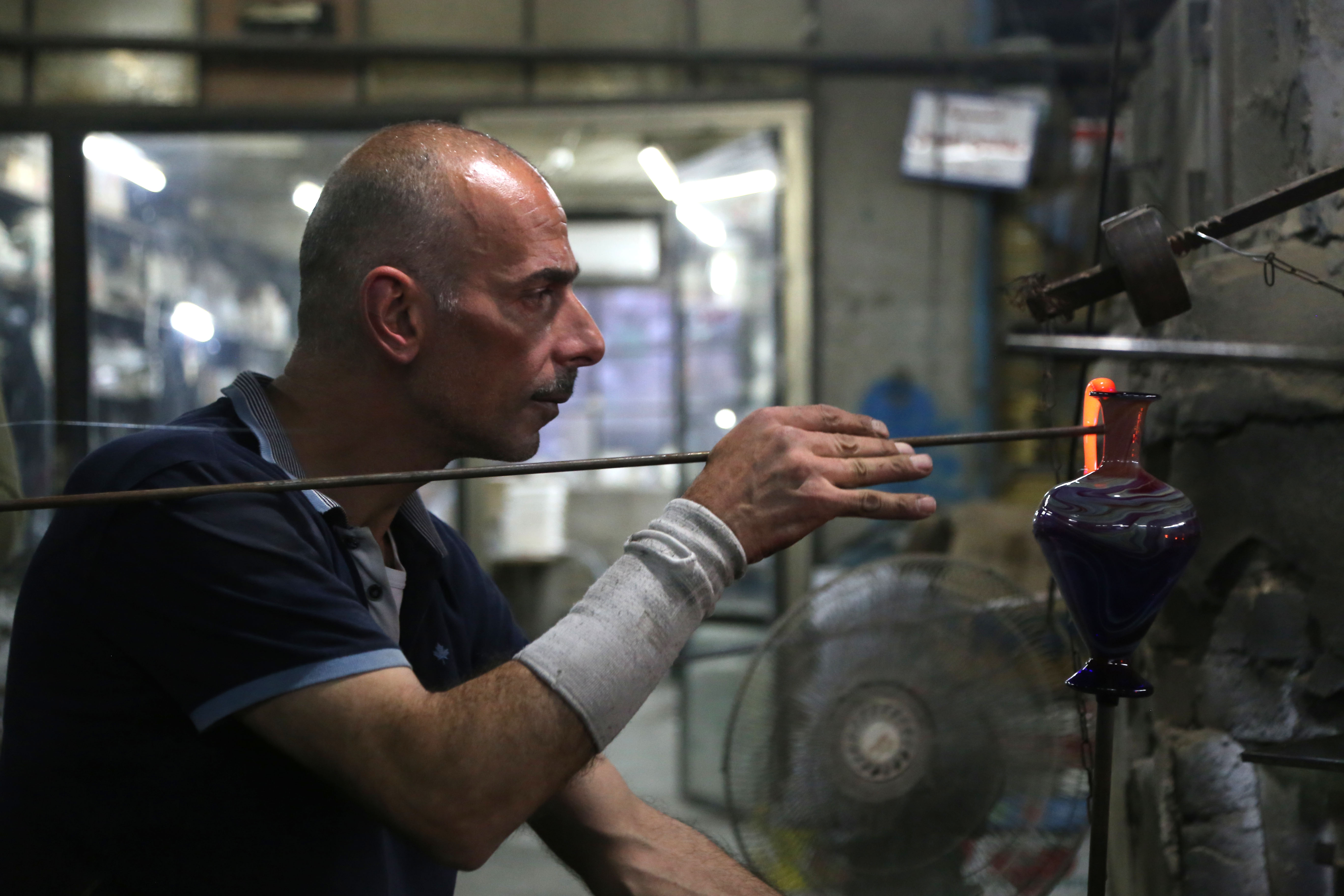  A glassblower works in the West Bank city of Hebron. The glass-blowing industry was established in Hebron during the time the Romans ruled the region, and the city has been known for its craft ever since.