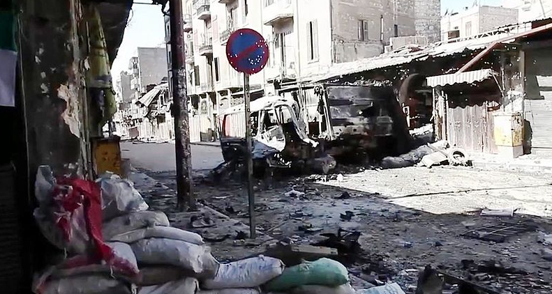 Bombed out vehicles in Aleppo, 2012. Image courtesy of Wikicommons.