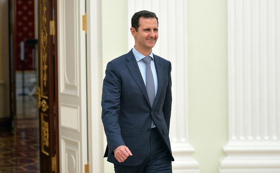 Bashar al-Assad smiling